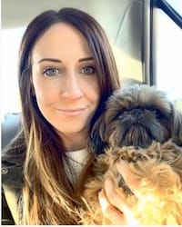 Photo of Mara Maeglin holding a lap dog