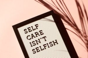 Sign that reads "self care isn't selfish"